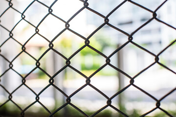 Close-up chain link fence , Sunset background