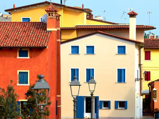 Fototapeta na wymiar Colorful Venetian houses of Caorle city