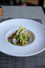 Lunch. Salad and meat. Wine