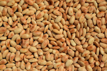 Freshly roasted almonds with salt background pattern