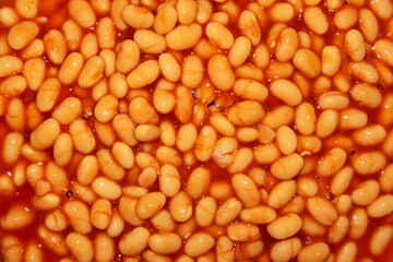 close-up of baked beans with tomato sause. top view