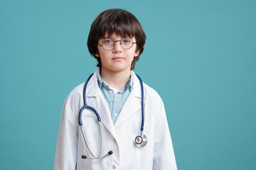 Little doctor in white coat