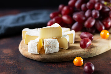 Still life with a bunch of grapes on a dark background with a copy of the space. Close-up. Space for text