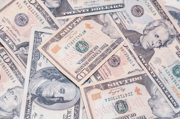 Close-up money in denominations 100, 20 and 10 US dollars, exchange currency cash, business investment, background from banknotes.