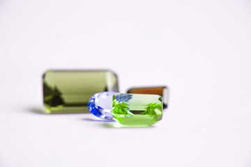 multicolored gemstones on white background close-up