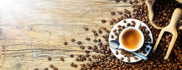 Coffee Espresso Cup With Beans On Wooden Table - obrazy, fototapety, plakaty