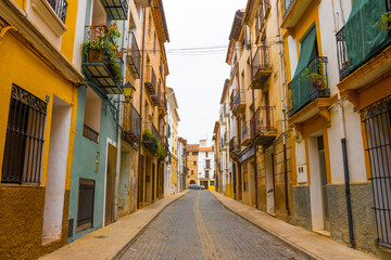 Fototapeta na wymiar Atzeneta del Maestrat, Castellon province, Valencian Community, Spain. Beautiful historic street. Traditional and typical spanish village. Nobody, Coronavirus period.