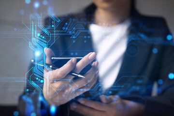 Businesswoman typing phone in office. High-tech hologram. International business concept. Double exposure.