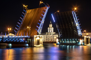 Plakat Laying bridges in St. Petersburg. Night city of Russia. Neva River. Reflection of colored lights in the water. Long-term exposure.