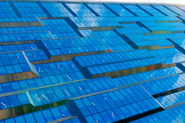 Abstract fragment of a modern building with glass facade for offices.