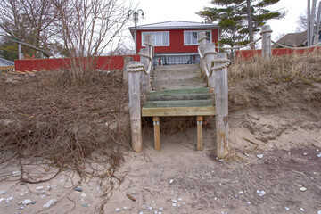 Stairs leading to beach that is showing erosion
