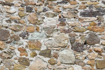 stone wall of old abandoned and dilapidated house in the Tuscan countryside in Italy