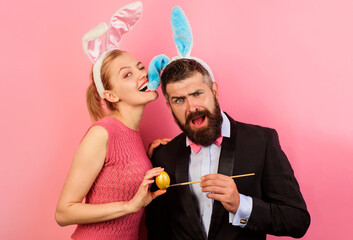 Family celebrate Easter. Bunny couple painting egg. Spring holidays.
