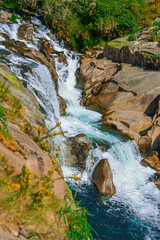 Fototapeta na wymiar Beautiful turquoise waterfall in Galicia