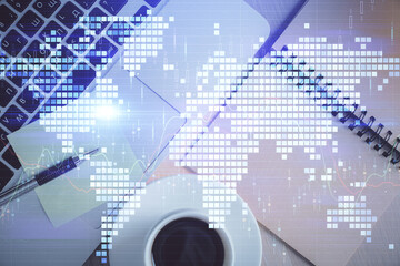 Business theme hologram drawings over computer on the desktop background. Top view. Multi exposure. Concept of international connections.
