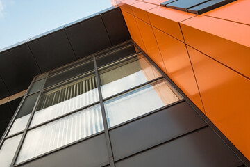 Geometric colored building facade elements with planes, lines and corners with light flare and reflections for an abstract background and texture of white, blue, gray colors. Place for text