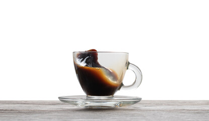 Cup of splashing coffee isolated on white