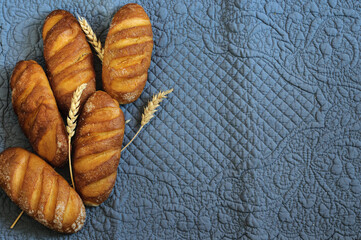 Top view of small white bread loaves with copy space. Flat lay