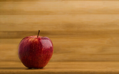 red apple on wooden background