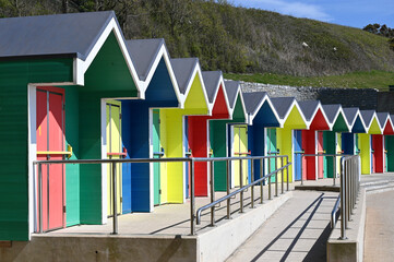 A row of colorful beach huts at Barry Island, Wales, UK
