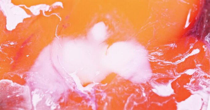Macro Textures with Vibrant Neon Color Palette. Abstract Background Made with Oil Mixed with Orange and White Dye, Ink, and Paint.