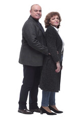 side view. an elderly married couple looking at the camera