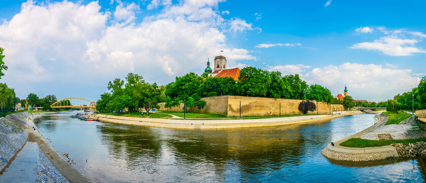 bishop castle and cathedral tower over the river in gyor city in Hungary