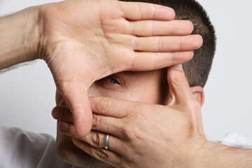 Fototapeta premium Close-up portrait of man playing with his hands. Mental issues. Psychology.