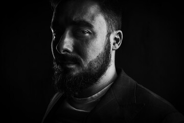 Fototapeta premium Portrait of a brutal young man with a beard. High quality photo