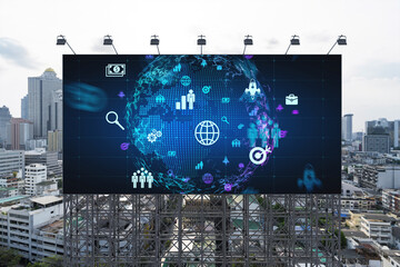 World planet Earth map hologram and social media icons on billboard over panorama city view of Bangkok, Southeast Asia. The concept of people networking and connections.