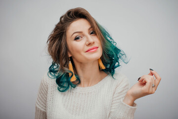 Colored curly hairs. Portrait smiling women. Turquoise ombre hair style. Gradient. White backround © RecCameraStock