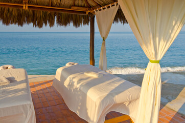 Fototapeta na wymiar Spa salon on beach of tropical island - healthcare background