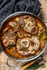 Stewed veal shank meat Osso Buco,  italian ossobuco steak. wooden background. Top view