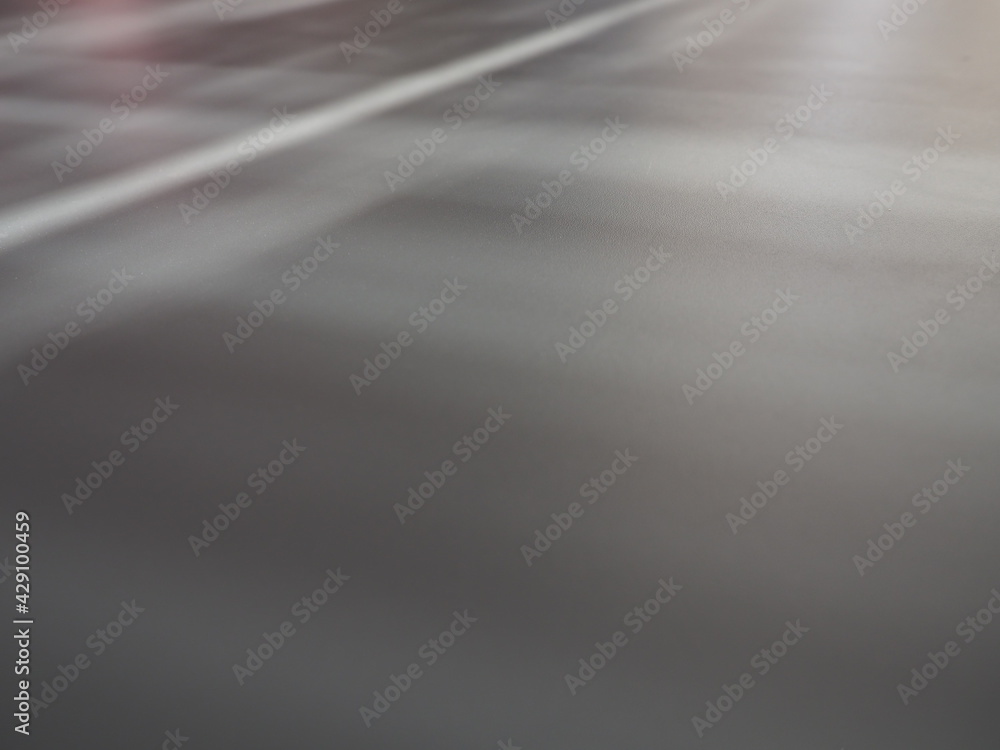 Poster illumination rays on gray surface. abstract rays of light and lens flare on a gray background. verti