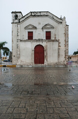 Front of Iglesia de San Juan Church on a rainy winter day in Campeche, Mexico.