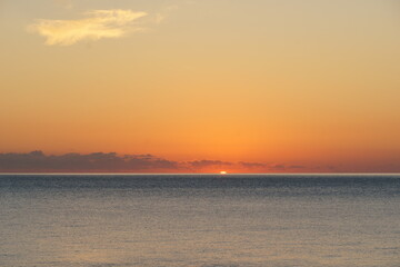 Sunrise over the calm sea