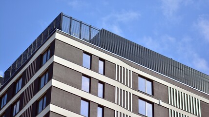 A fragment of modern architecture, walls and glass. Detail of New luxury house and home complex. Part of city real estate property and condo architecture.