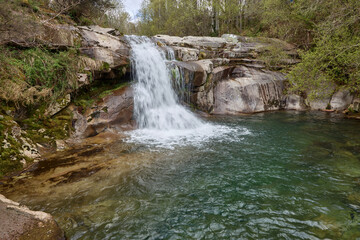 Natural pool formed in the rocks by the Cerves river in the community of Galicia, Spain.