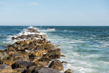 Stone jetty along an Atlantic Ocean inlet to the the Intracoastal Waterway, Ponce Inlet Lighthouse Point Part, Florida, USA.