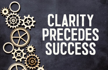 Clarity, Precedes, Success write on sticky notes isolated on office desk