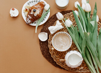Coffee cup and bouquet of white tulips . Concept of holiday, birthday, Women Day. Romantic Feminine flat lay. Good morning. still life.