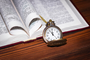 a pocket watch with book background