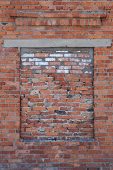 A bricked-up window in a brick wall. Isolation mode. Communication with the outside world.
