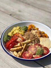 vegan bowl with hummus and pumpkin