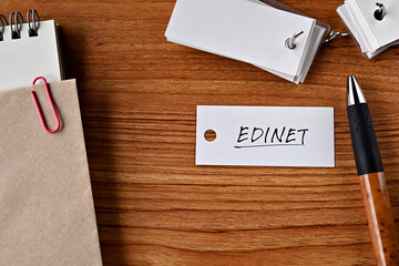There is a word book with the word EDINET written on it. It is an abbreviation for financial term Electronic Disclosure for Investors' NETwork.