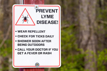 Warning sign about Lyme Disease posted at a trailhead