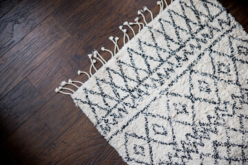 diagonal fringe rug on hardwood