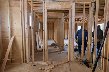 Interior beam wood framework of new residential home under construction