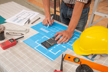 concept team Architect Inspect the project design with blueprintsconstruction site .Selective Focus