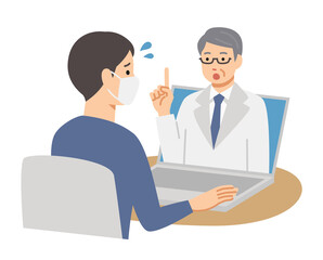 パソコンでオンライン診療を受ける病気の男性